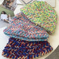 Knitted Bucket Hat showing three color options 