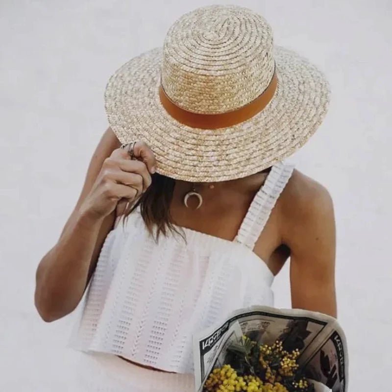 sun hat with ribbon on a model showing closeup of the hat 