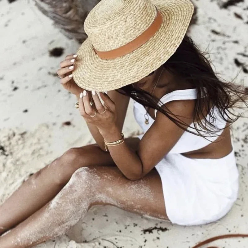 sun hat with ribbon on model at the beach