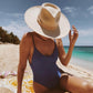 fedora cowboy hat on model at the beach