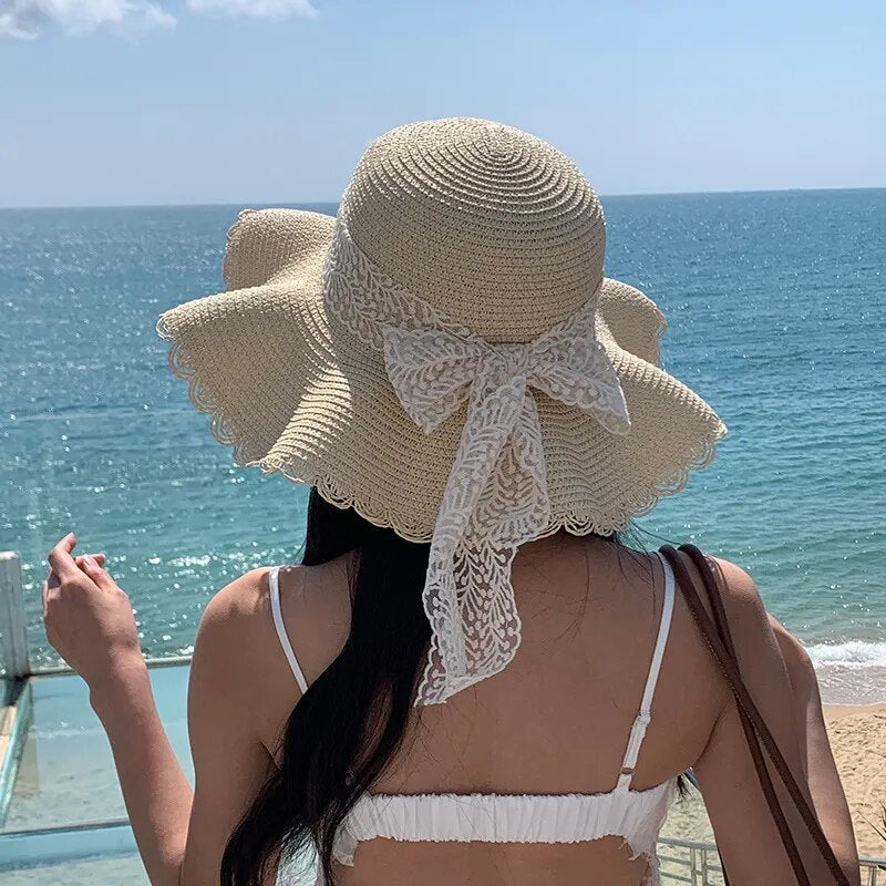 cute sun hat on model showing bow in back