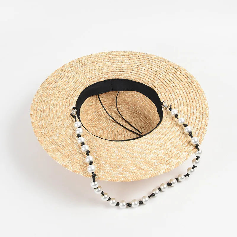 straw hat with pearl chain showing inside of hat 