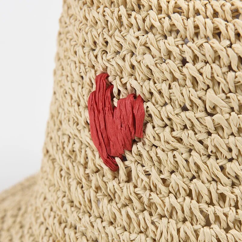 crochet bucket hats close up of heart emblem 