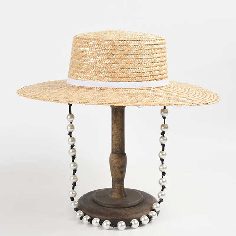 straw hat with pearl chain showing white ribbon hat on stand