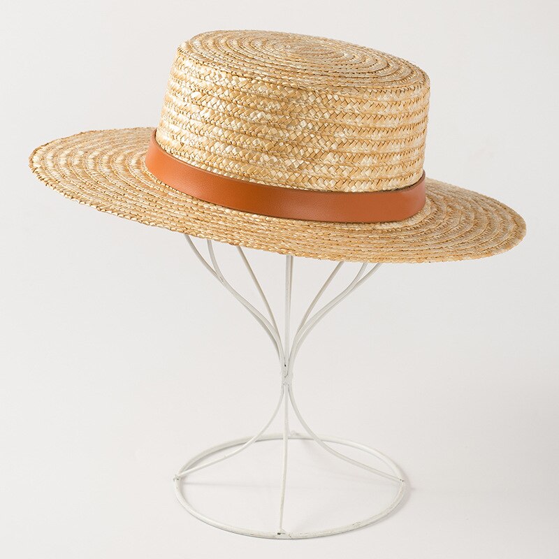 sun hat with ribbon showing side view of hat on a stand 