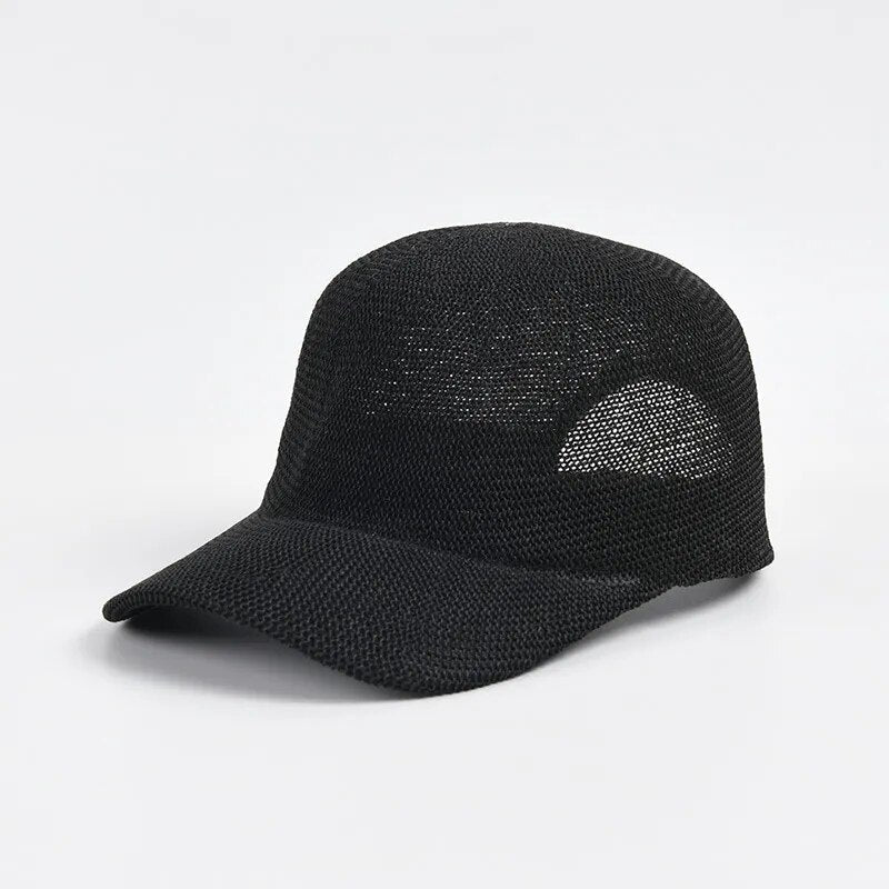 straw baseball cap  in black on white background 