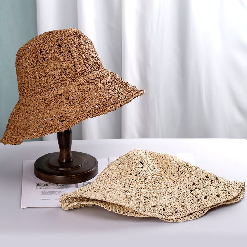 woven bucket hat showing one hat in stand and the other flat on table