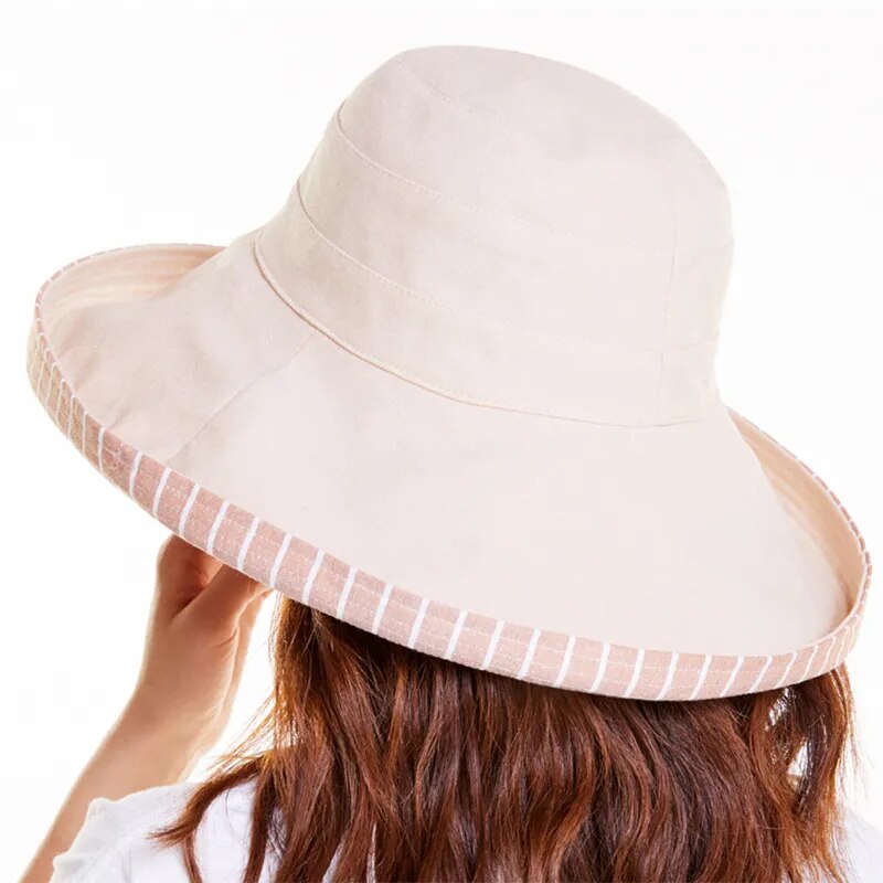brimmed sun hat in beige showing back of hat 