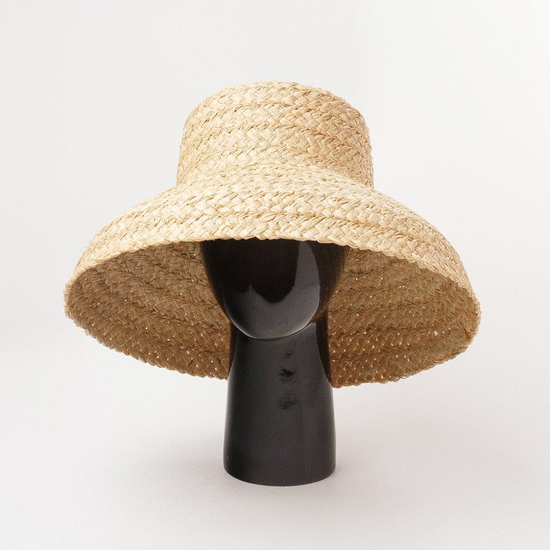 raffia bucket hat on stand showing view of the hat looking up