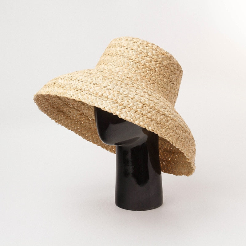 raffia bucket hat on stand showing side view