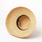 raffia bucket hat on white background showing inside of hat 