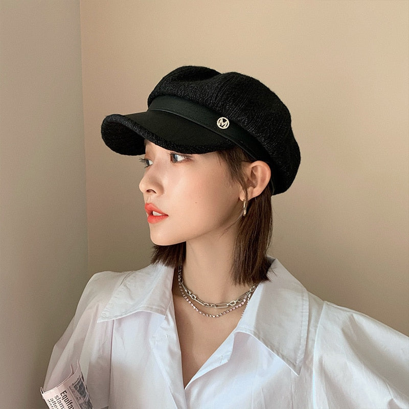 newsboy hat womens shown in black on model side view 