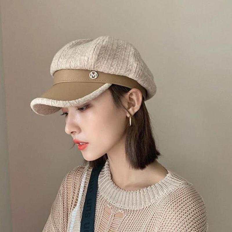 newsboy hat womens shown on model in tan with a side view 
