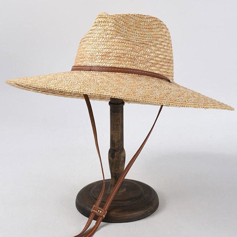 sun hat with strap on stand showing full view of hat with strap
