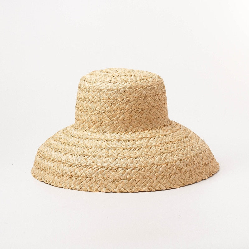 raffia bucket hat on white background showing hat