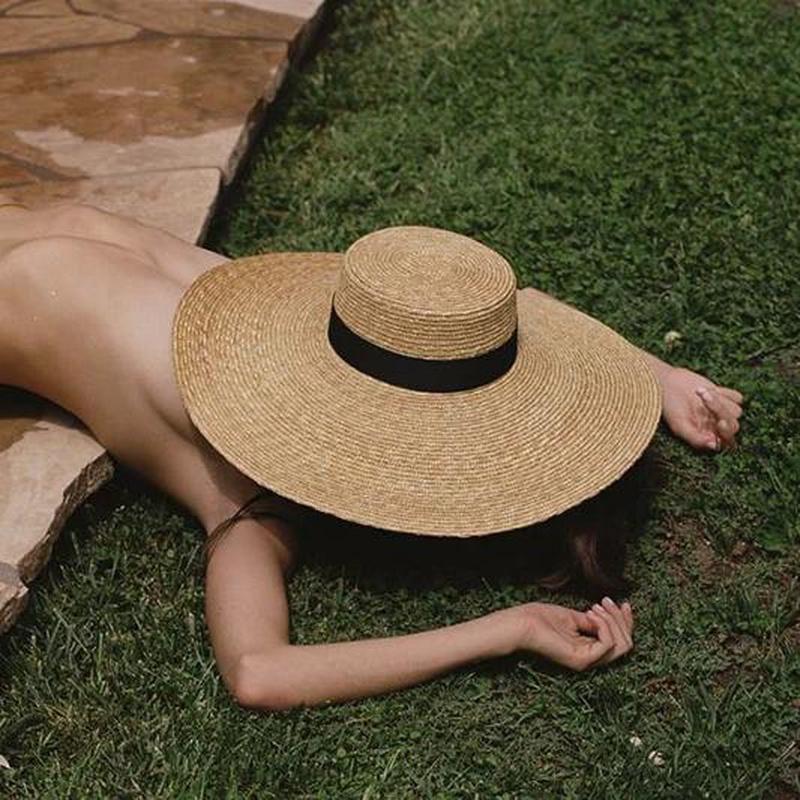 Wide Brim Hat on a model taking a nap with the hat on