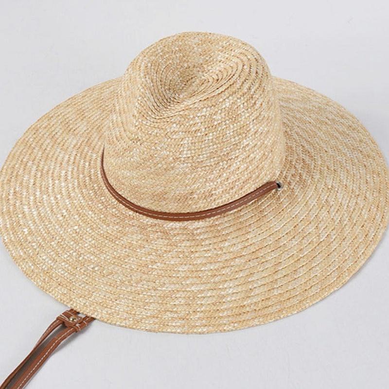 sun hat with strap on white background showing top of hat