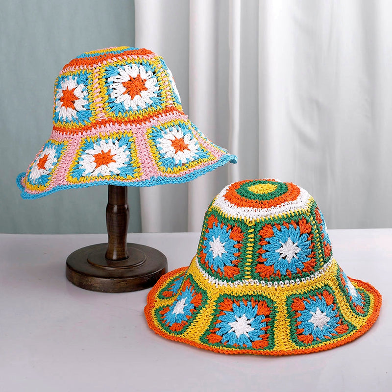 knit bucket hat showing one hat on stand and on on table