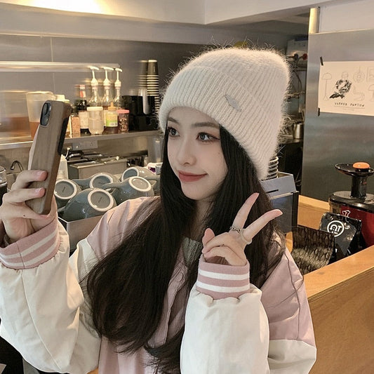 warm beanie on model showing peace sign