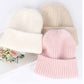 Plush Beanie show three color options laying flat